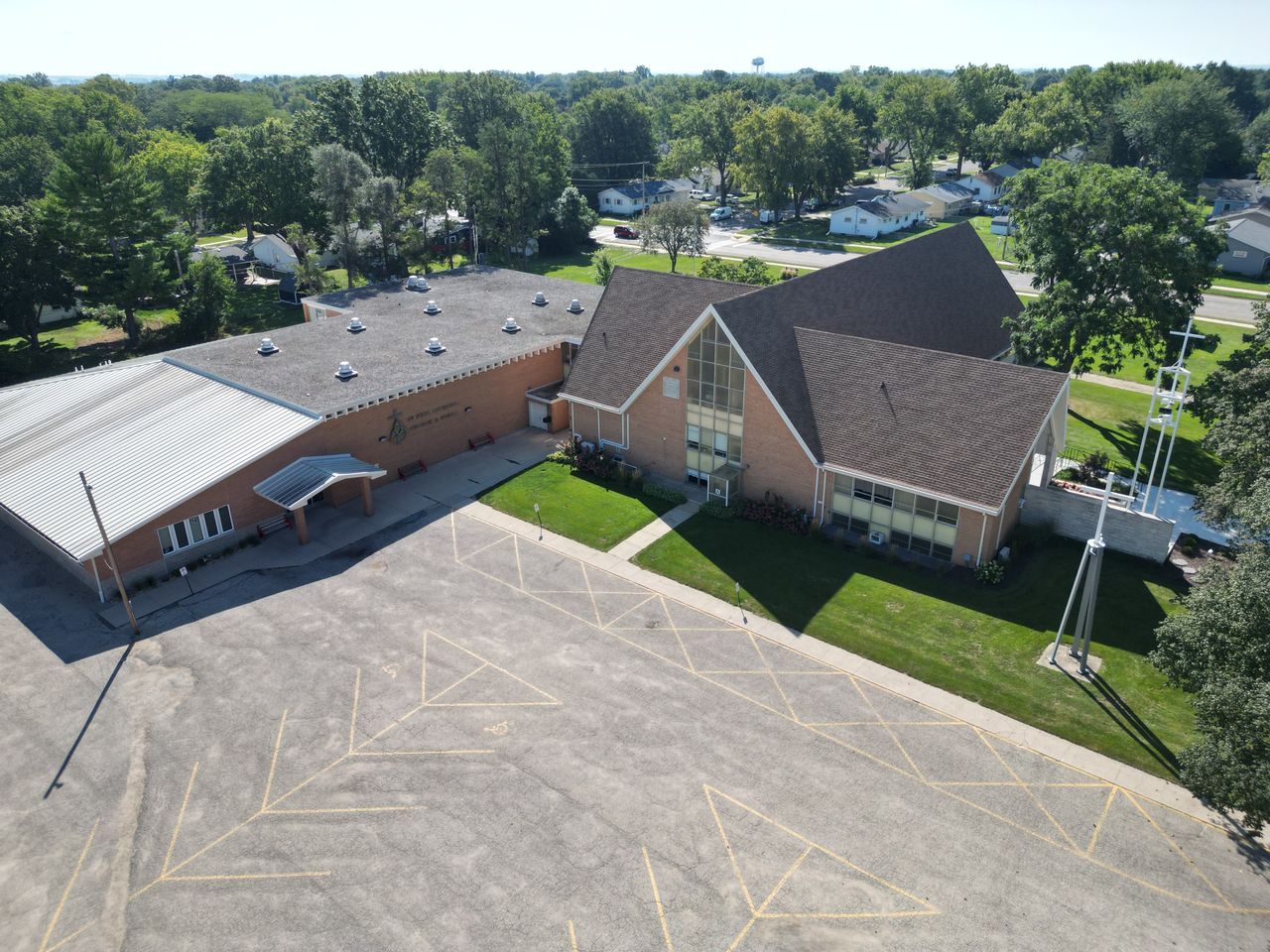 Aerial view of the St. Paul Lutheran School and church campus in Rochelle, with the school sign, parking, and grounds.