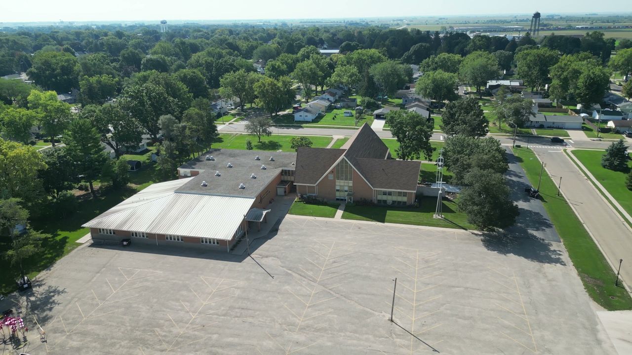 The church and school buildings and the parking lot on the Rochelle campus.